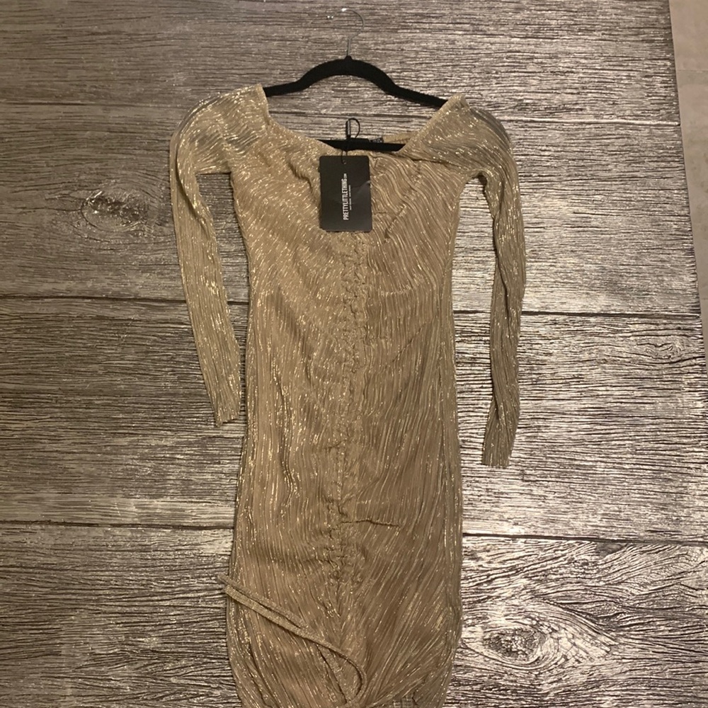 Gold dress with tag . Size4